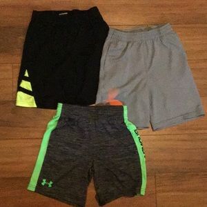 Three pair of Under Armour athletic shorts.